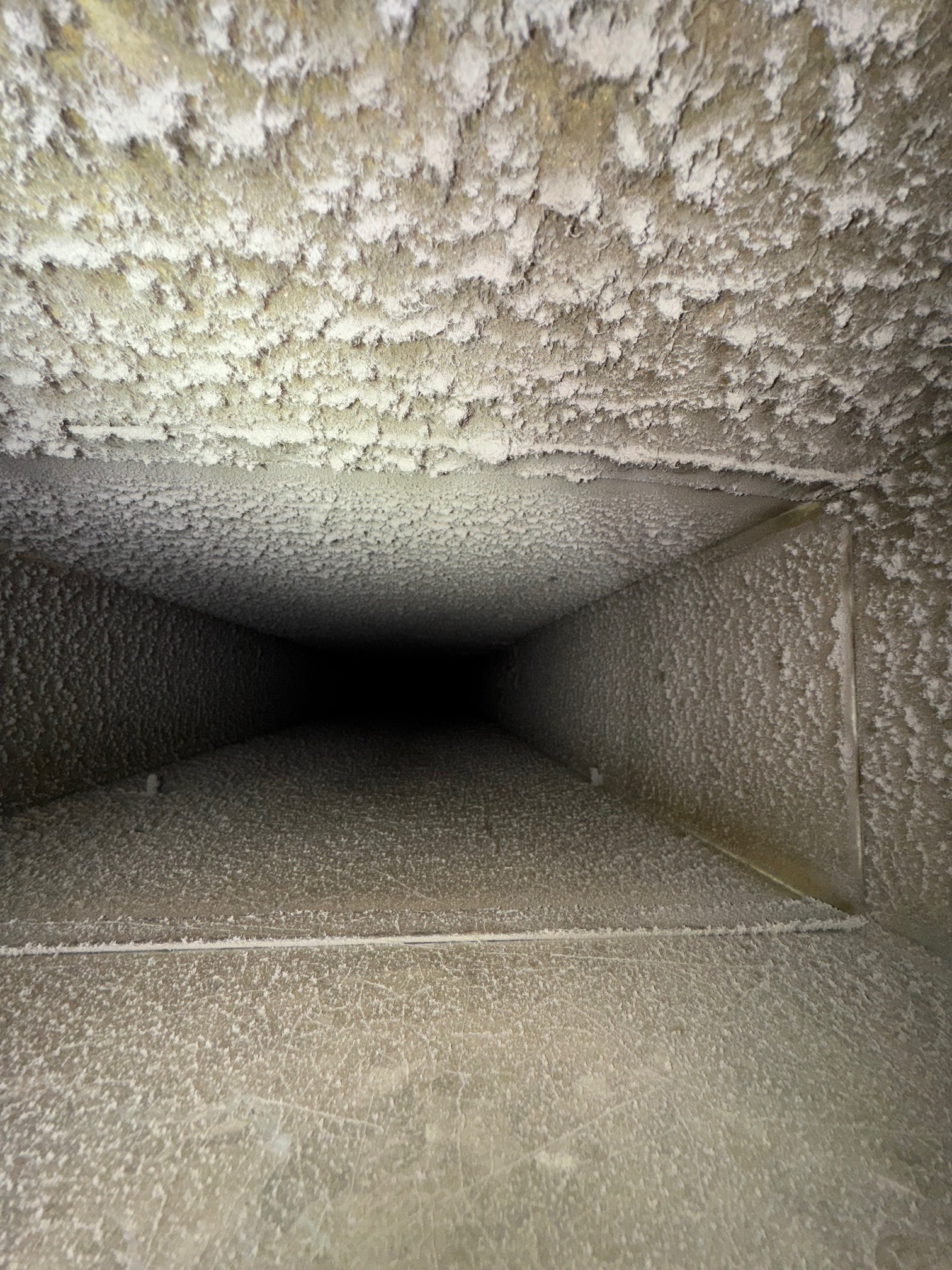 Dust buildup inside an HVAC duct