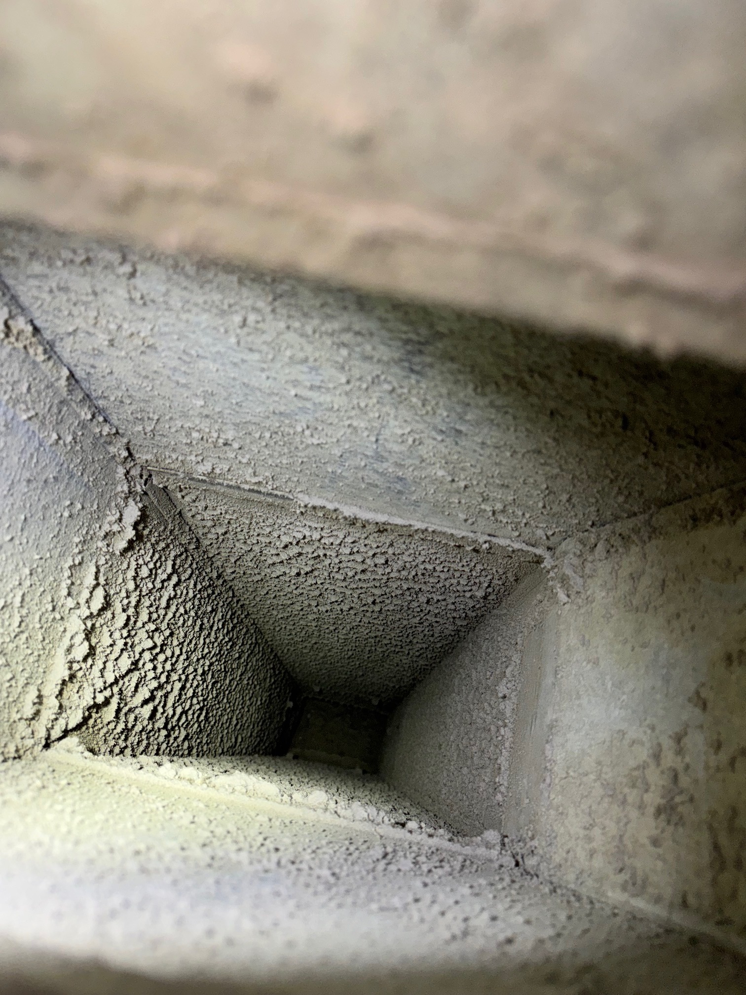 Dust buildup in an HVAC branch duct